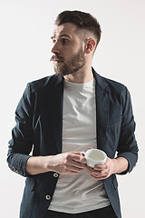 Image showing Portrait of stylish handsome young man with cup of coffee