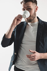 Image showing Portrait of stylish handsome young man with cup of coffee