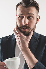 Image showing Portrait of stylish handsome young man with cup of coffee