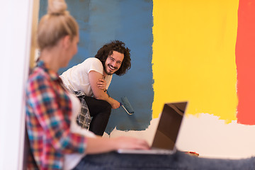 Image showing Happy couple doing home renovations