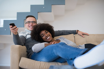 Image showing multiethnic couple relaxing at home