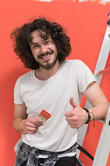 Image showing man with funny hair over color background with brush