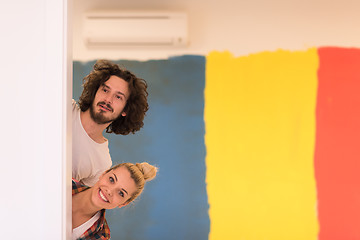 Image showing portrait of a couple painting interior wall