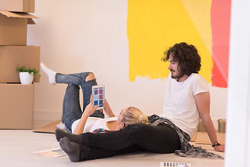 Image showing Happy young couple relaxing after painting