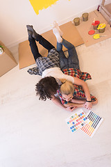 Image showing Happy young couple relaxing after painting