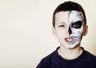 Image showing little cute boy with facepaint like skeleton to celebrate hallow