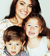 Image showing young mother with two children on white, happy smiling family in