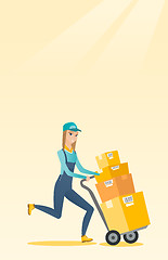 Image showing Delivery postman with cardboard boxes on trolley.