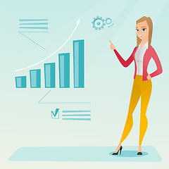 Image showing Successful business woman pointing at chart.