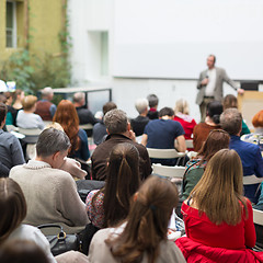 Image showing Man giving presentation in lecture hall at university.