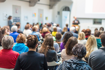 Image showing Man giving presentation in lecture hall at university.