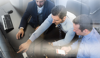 Image showing Business team analyzing data on computer.