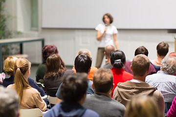 Image showing Woman giving presentation in lecture hall at university.