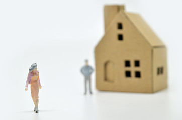 Image showing Women is leaving her man and house