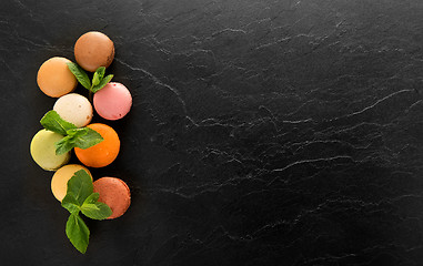 Image showing Macarons on black table