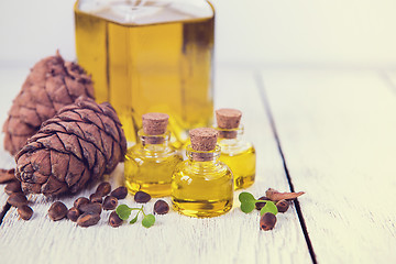 Image showing The cedar oil in a glass bottle