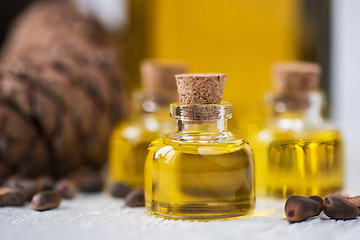 Image showing The cedar oil in a glass bottle