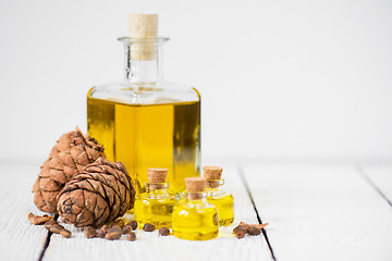 Image showing The cedar oil in a glass bottle