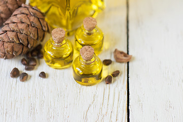 Image showing The cedar oil in a glass bottle