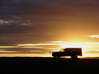 Image showing  Old vehicle at sunset