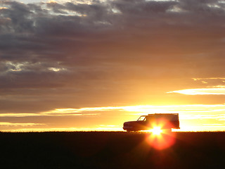 Image showing  Old vehicle at sunset