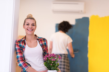 Image showing happy young couple doing home renovations