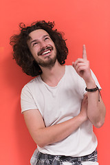 Image showing young man with funny hair over color background