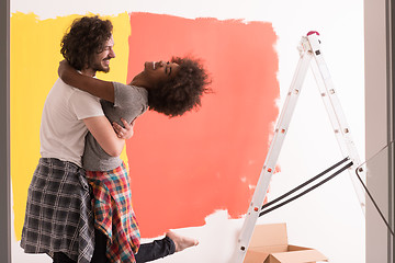 Image showing Young happy multiethnic couple hugging