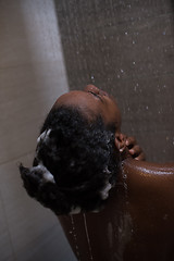 Image showing African American woman in the shower