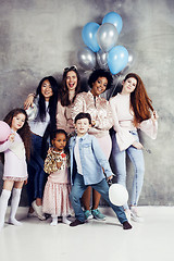 Image showing Lifestyle and people concept: young pretty diversity nations woman with different age children celebrating on birth day party together happy smiling, making selfie. African-american, asian and caucasi