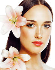 Image showing young attractive lady close up with hands on face isolated flowe