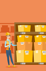 Image showing Warehouse worker scanning barcode on box.