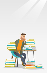 Image showing Student sitting at the table with piles of books.