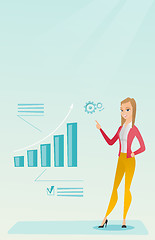 Image showing Successful business woman pointing at chart.