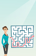 Image showing Business woman looking at labyrinth with solution