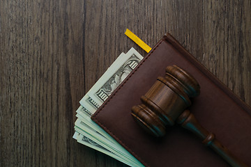 Image showing Judge on folder with dollars