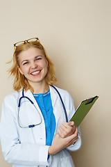 Image showing Blonde doctor with green folder
