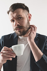 Image showing Portrait of stylish handsome young man with cup of coffee