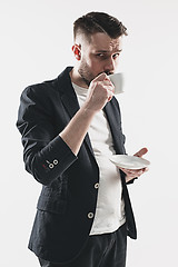 Image showing Portrait of stylish handsome young man with cup of coffee