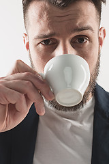 Image showing Portrait of stylish handsome young man with cup of coffee