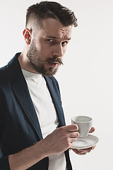 Image showing Portrait of stylish handsome young man with cup of coffee