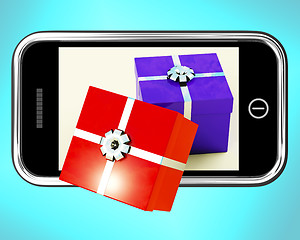Image showing Gift Boxes Coming From Mobile Phone Shows Buying Presents Online