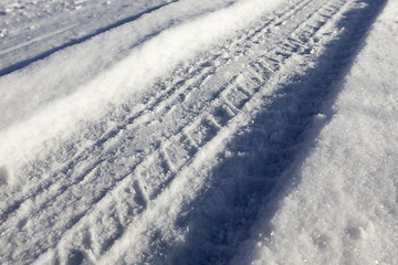 Image showing traces of the car on snow