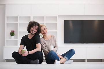 Image showing young couple in their new home