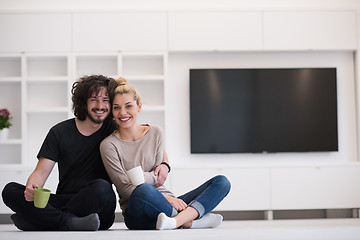 Image showing young couple in their new home