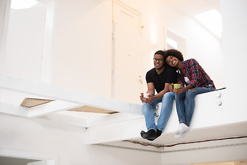 Image showing couple having break during moving to new house