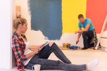 Image showing couple doing home renovations