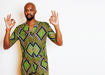 Image showing portrait of young handsome african man wearing bright green nati