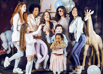 Image showing Lifestyle and people concept: young pretty diversity nations woman with different age children celebrating on birth day party together happy smiling, making selfie. African-american, asian and caucasi