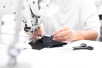 Image showing Constructor. Sewing on a machine.  Sewing machine 